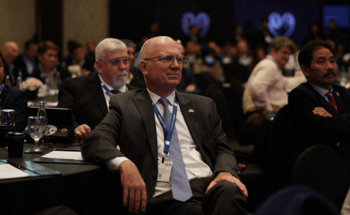 A man listens intently in the conference