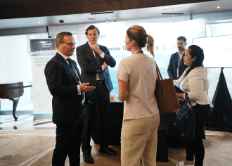 Business professionals networking at CrewConnect Global